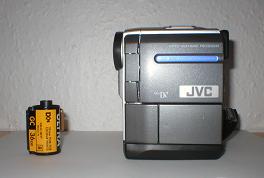 JVC GRDVX507 video camera beside 35mm film